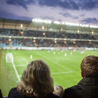 Image of rear-view-of-people-watching-soccer-match-at-stadi-2023-11-27-05-30-50-utc